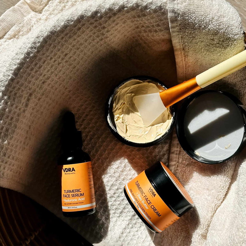 VDRA's Turmeric Trio on top of a basket with a face towel. 