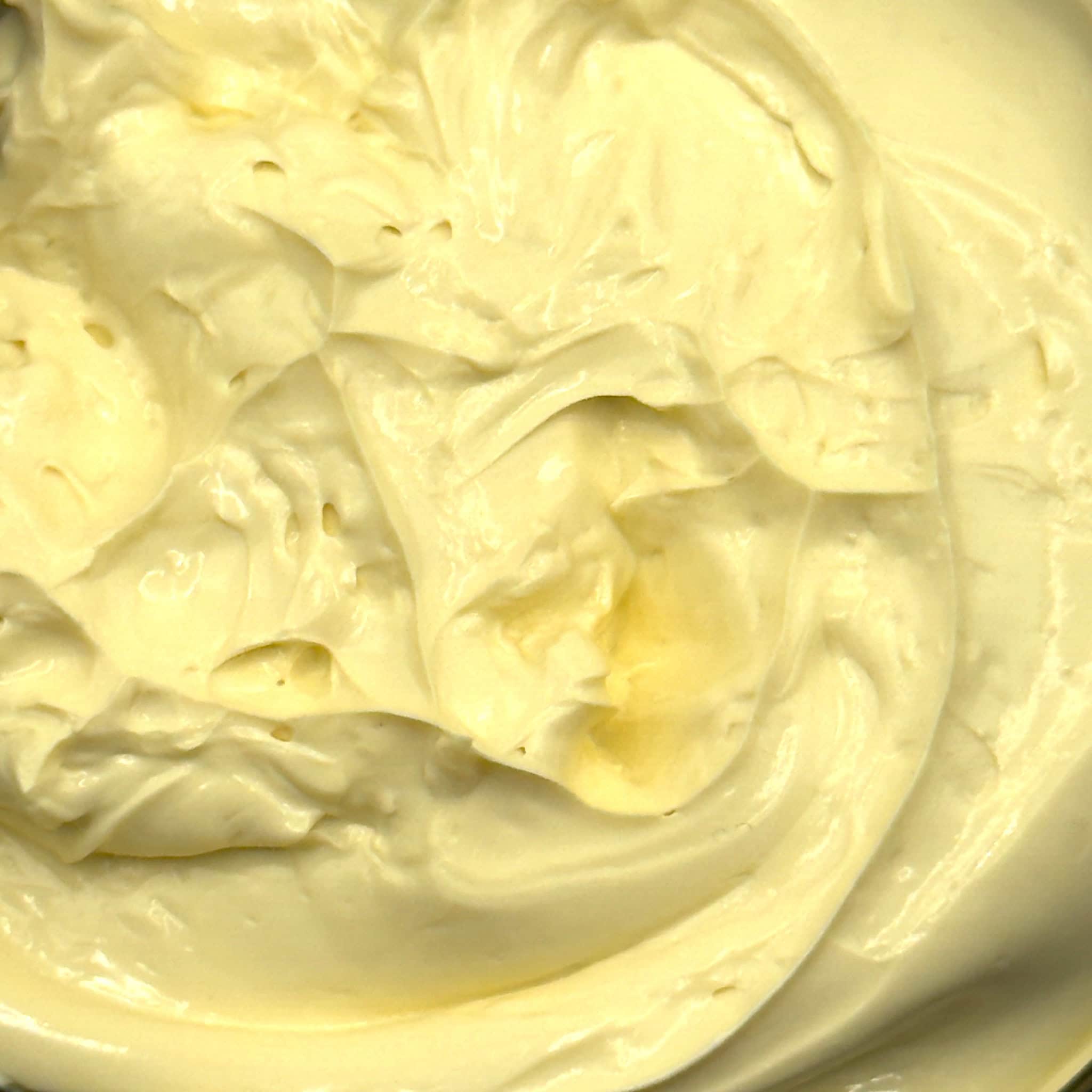 Close-up of  the creamy, smooth texture of the turmeric clay mask